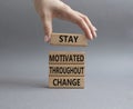 stay motivated throughout change symbol. Concept words stay motivated throughout change on wooden blocks. Beautiful grey Royalty Free Stock Photo