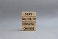 stay motivated throughout change symbol. Concept words stay motivated throughout change on wooden blocks. Beautiful grey Royalty Free Stock Photo