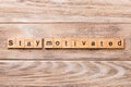 Stay motivated word written on wood block. Stay motivated text on wooden table for your desing, concept Royalty Free Stock Photo