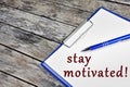 Stay motivated words on white paper Royalty Free Stock Photo