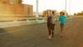 Stay one step ahead. three friends out jogging in the city in the early morning. Royalty Free Stock Photo