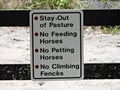 Stay Out of Pasture, No Feeding Horses, No Petting Horses, No Climbing Fences - sign