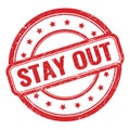 STAY OUT text on red grungy vintage round stamp Royalty Free Stock Photo