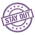 STAY OUT text written on purple violet vintage stamp Royalty Free Stock Photo