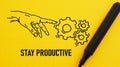 Stay productive is shown using the text and picture of hand with gears Royalty Free Stock Photo