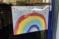 A Stay Safe from Coronavirus Rainbow picture in a shop window