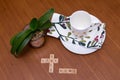 Stay Safe Home message written on walnut table set with white plate, napkin, coffee cup and small houseplant Royalty Free Stock Photo