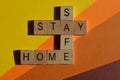 Stay Safe, Stay Home, crossword in wooden alphabet letters Royalty Free Stock Photo