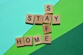 Stay, Safe, Home, words in 3d wooden alphabet letters Royalty Free Stock Photo
