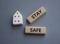 Stay Safe symbol. Concept word Stay Safe on wooden blocks. Beautiful grey background. Business and Stay Safe concept. Copy space Royalty Free Stock Photo