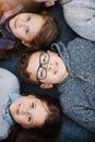 Stay in school because school is cool. High angle portrait of elementary school kids lying on the floor at school. Royalty Free Stock Photo