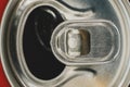 Stay-on-tab opening mechanism On an aluminum beverage can. Can of soda lemonade macro view.