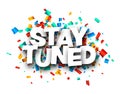 Stay tuned sign with colorful cut out ribbon confetti background