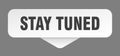 stay tuned sticker. stay tuned sign isolated on gray background Royalty Free Stock Photo