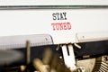 Stay tuned symbol. Concept words Stay tuned typed on beautiful old retro typewriter. Beautiful white background. Business, support