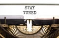 Stay tuned symbol. Concept words Stay tuned typed on beautiful old retro typewriter. Beautiful white background. Business, support