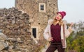 Stay warm and fashionable. Woman wear furry coat. Winter clothes. Wardrobe for cold weather. Girl stand near stone ruins