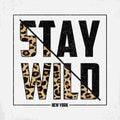 Stay Wild - composite slogan with leopard texture. T-shirt typography print with animal skin. Tee shirt trendy print. Vector.