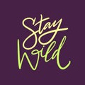 Stay Wild hand drawn vector quote lettering. Motivational typography. Isolated on Violet background Royalty Free Stock Photo