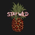 Stay wild slogan, leopard print, pineapple, graphic tee, printed design.