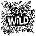 Stay wild word hand lettering with floral decoration.
