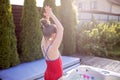 Staycation in summer cottage. Kid cooling off in the swimming pool, happy summertime Royalty Free Stock Photo