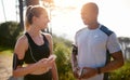 Staying fit with a friend. a fit young couple working out together outdoors. Royalty Free Stock Photo