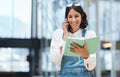 Staying organised will give you more time to work on important tasks. a young businesswoman talking on a cellphone while