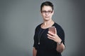 Staying organized and up to date with her smart phone. Studio shot of a young businesswoman using a mobile phone against Royalty Free Stock Photo