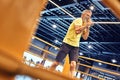 Staying physically active. Athletic mature man in sportswear boxing while standing on the ring at gym