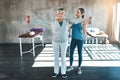 Staying strong in the senior years. a senior woman using weights with the help of a physical therapist.