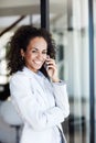 Staying in touch. an attractive young businesswoman making a call on her mobile phone. Royalty Free Stock Photo