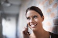 Staying in touch with clients and colleagues. An attractive young businesswoman talking on the cellphone. Royalty Free Stock Photo