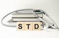 STD Sexually transmitted infections text on wooden cubes. medical concept