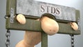 Stds impact and social influence shown as a figure in pillory to depict Stds`s effect on human health and its significance and Royalty Free Stock Photo