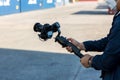 Steadicam with DSLR camera for video production are shooting movie in wedding ceremony. stabilize tool. stabilizer control machine Royalty Free Stock Photo