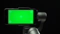 Steadicam with green screen smartphone rising up and falling down.