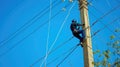 With a steady gaze, he repairs live wires with utmost precision.