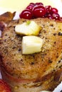 Steak in bacon with cranberry, pepper, honey and garlic. Royalty Free Stock Photo