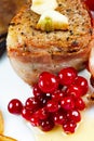 Steak in bacon with cranberry, pepper, honey and garlic. Royalty Free Stock Photo