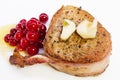 Steak in bacon with cranberry, pepper, honey and garlic. Royalty Free Stock Photo