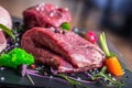 Steak.Beef steak.Meat.Portioned meat.Raw fresh meat.Sirloin steak.T-Bone steak. Flank steak. Duck breast. Vegetable decoration. Royalty Free Stock Photo