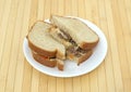 Steak cheese and vegetable sandwich on a white plate Royalty Free Stock Photo