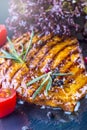 Steak chicken breast olive oil cherry tomatoes pepper and rosemary herbs. Royalty Free Stock Photo