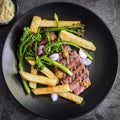 Steak and Chips with Broccolini Mustart Shallots and Bernaise Sauce Top View Royalty Free Stock Photo