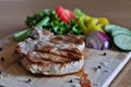 Steak cooked on barbecure with vegetables to make salad Royalty Free Stock Photo