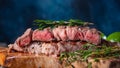 Steak cooked in Rare, marbled beef. With rosemary on a kitchen wood background. Cooking meat, cooking recipes, recipe book