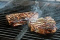Steak cooking on flame grill Royalty Free Stock Photo