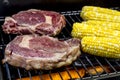 Steak and Corn on Hot Grill Royalty Free Stock Photo