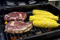 Steak and Corn on Hot Grill Royalty Free Stock Photo